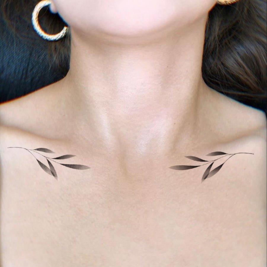 Leafy tattoo on girl neck