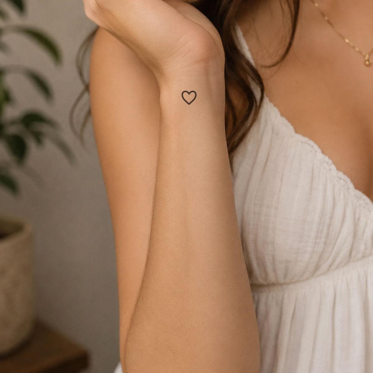 Heart tattoo on woman hand