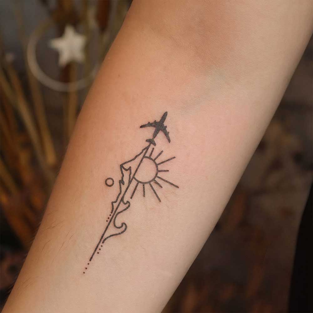 Adventure Awaits tattoo on Arm