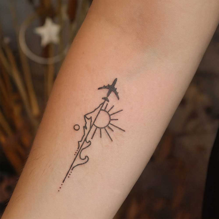 Adventure Awaits tattoo on Arm