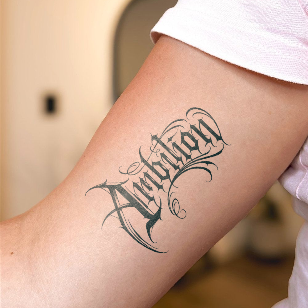 Ambition Tattoo on arm