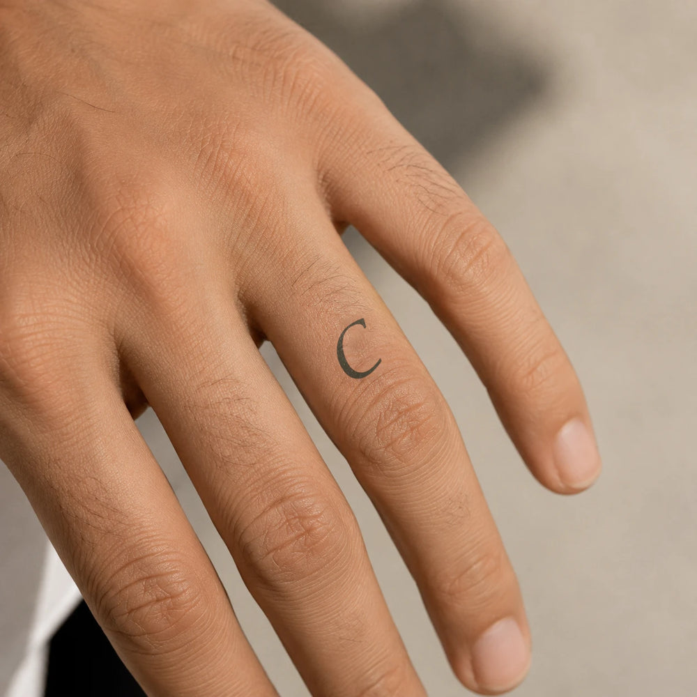 C Letter Tattoo on hand