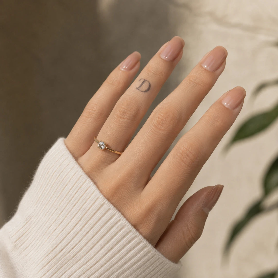 D Letter Tattoo on hand