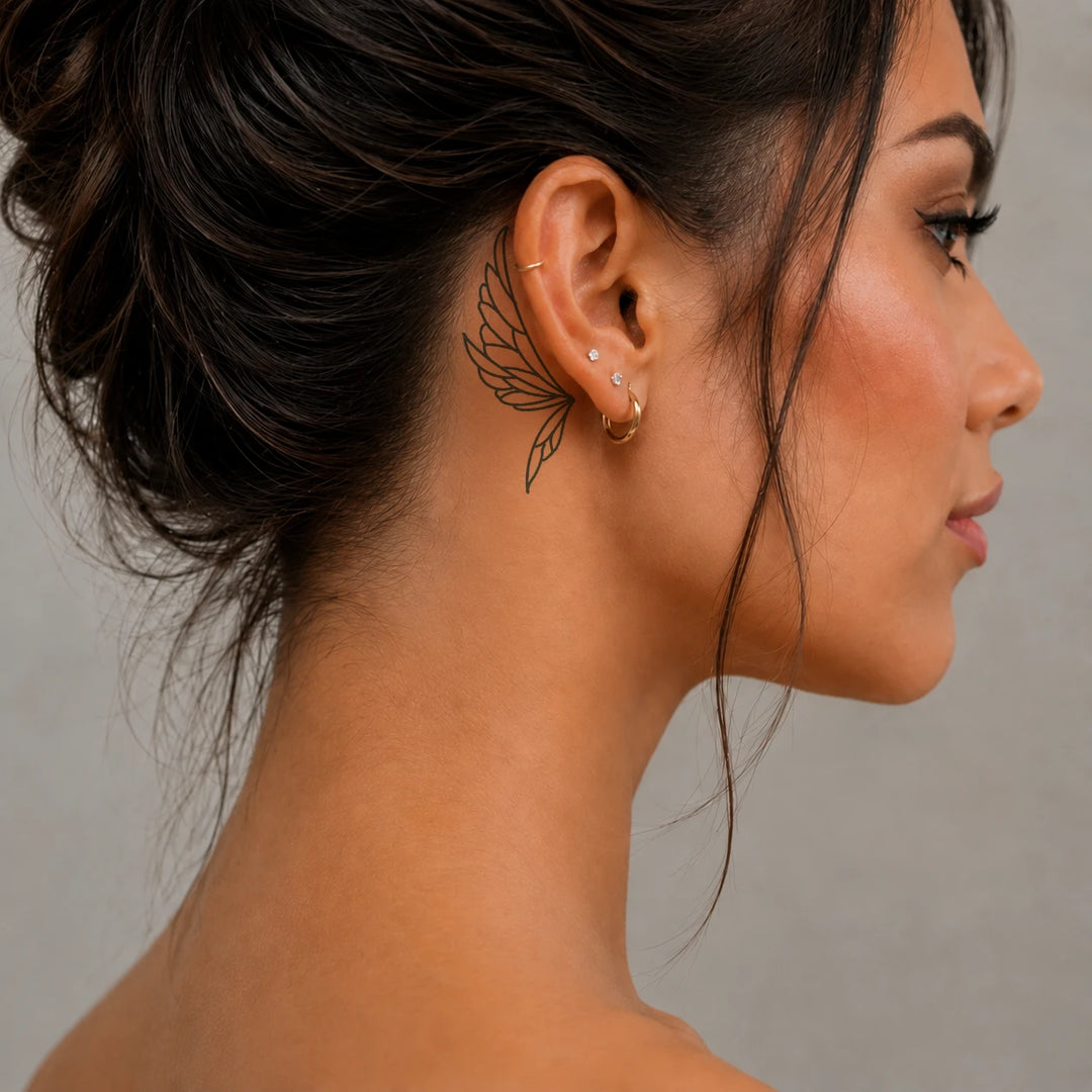 Earwings_tattoo_on_women_behind_ear