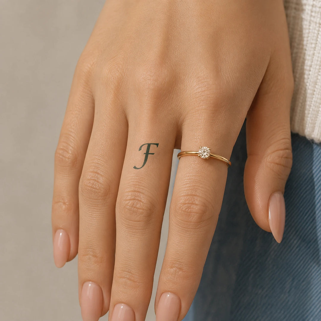 F Letter Tattoo On Girl Hand