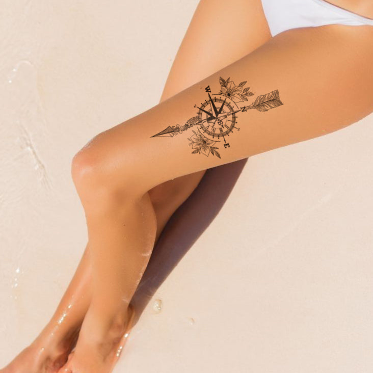 Floral Compass tattoo on leg