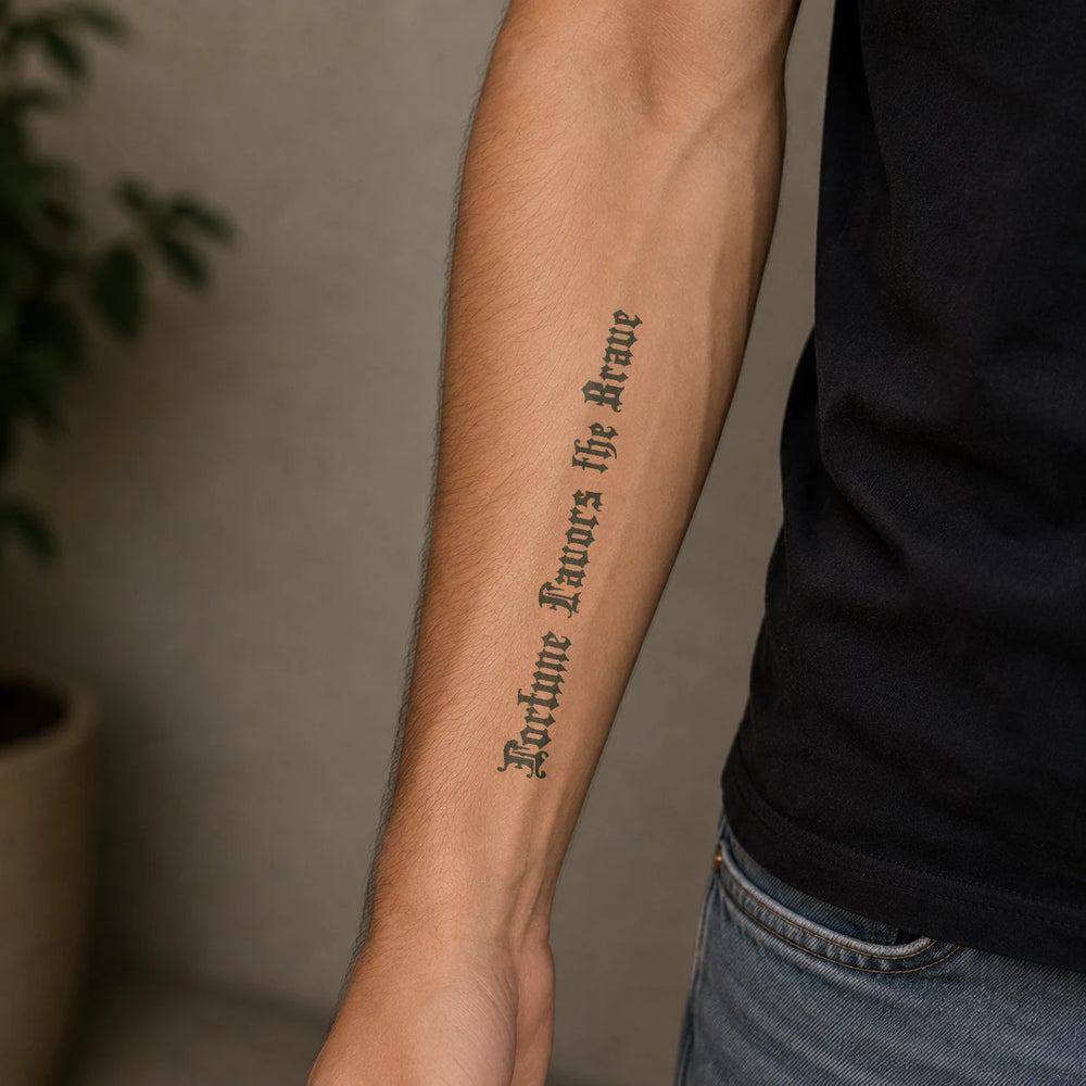 Fortune Favours The Brave tattoo on man arm