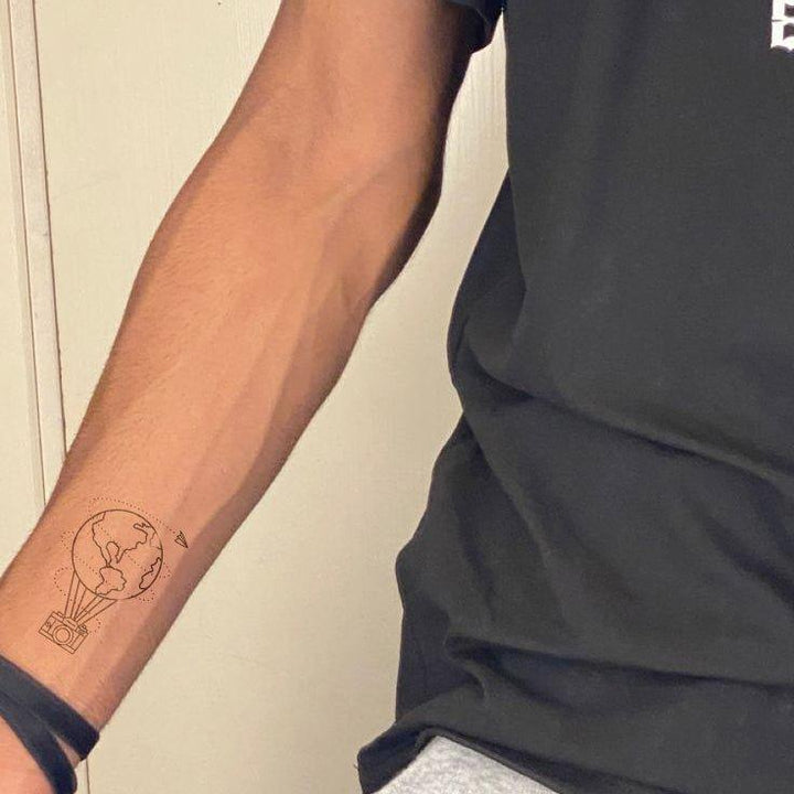Globetrotter’s Camera Tattoo  On Arm
