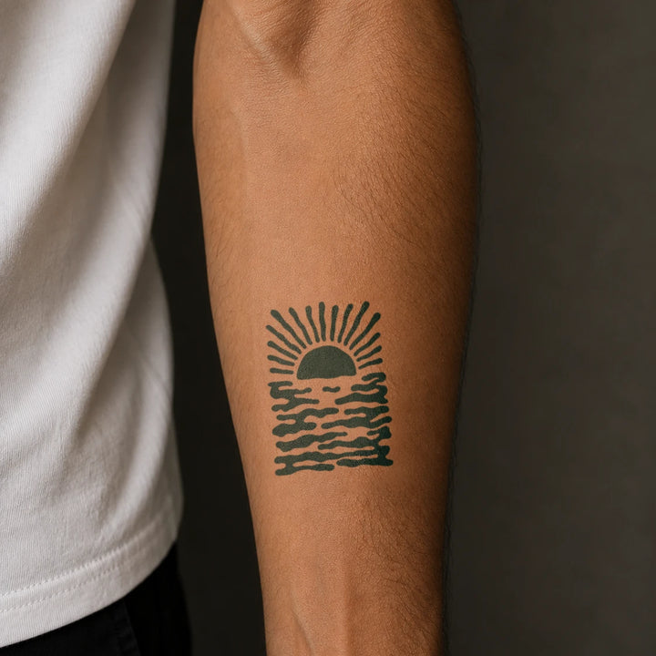 Groovy Sunset tattoo on man arm