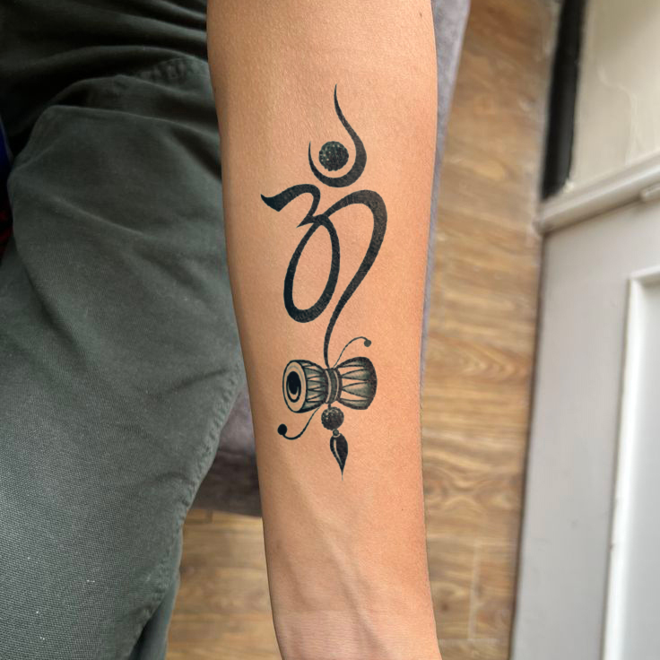 Om Damru tattoo on hand