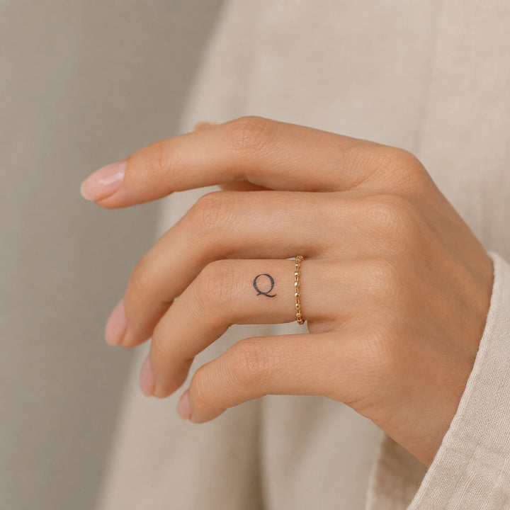 Q Letter Tattoo Tattoo on hand