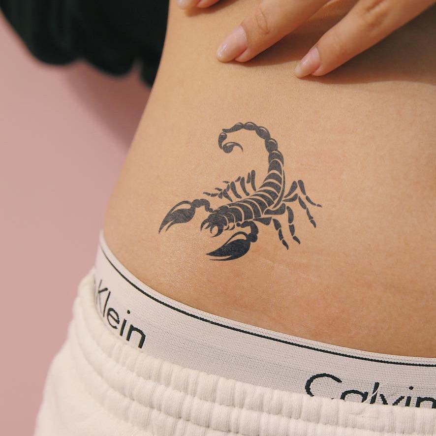 Scorpion Tattoo on girl waist 