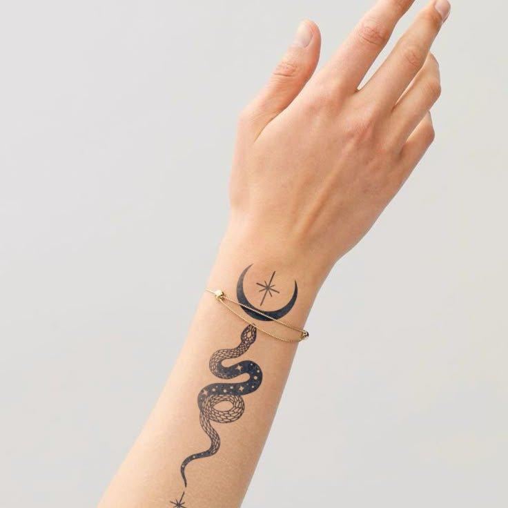 Snake of Growth tattoo on hand