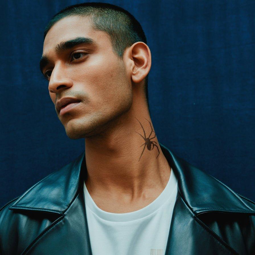 Spider tattoo on neck