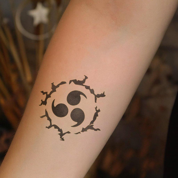 Swirling Triskelion tattoo on arm