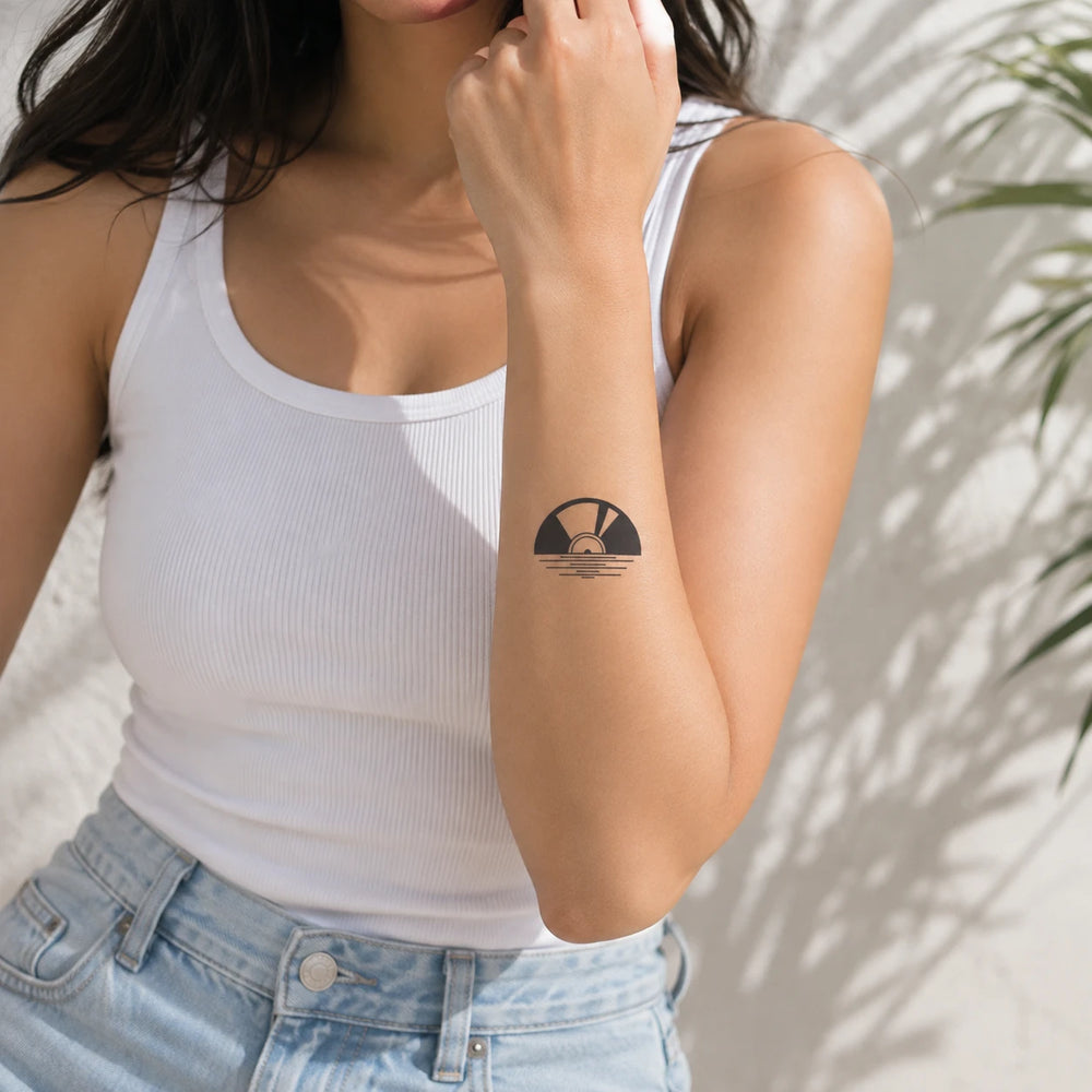 Vinyl Sunset Tattoo On Forearm