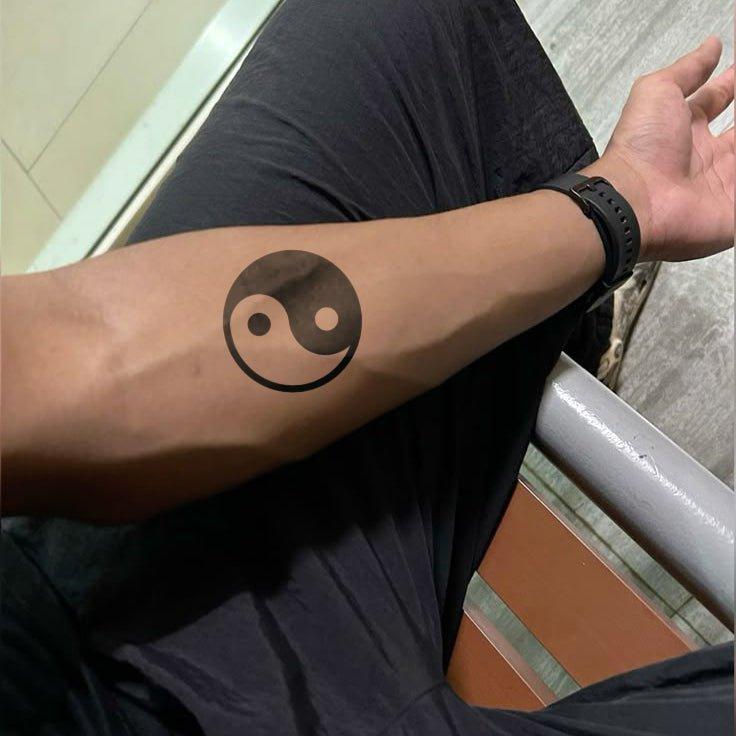 Yin Yang tattoo on hand