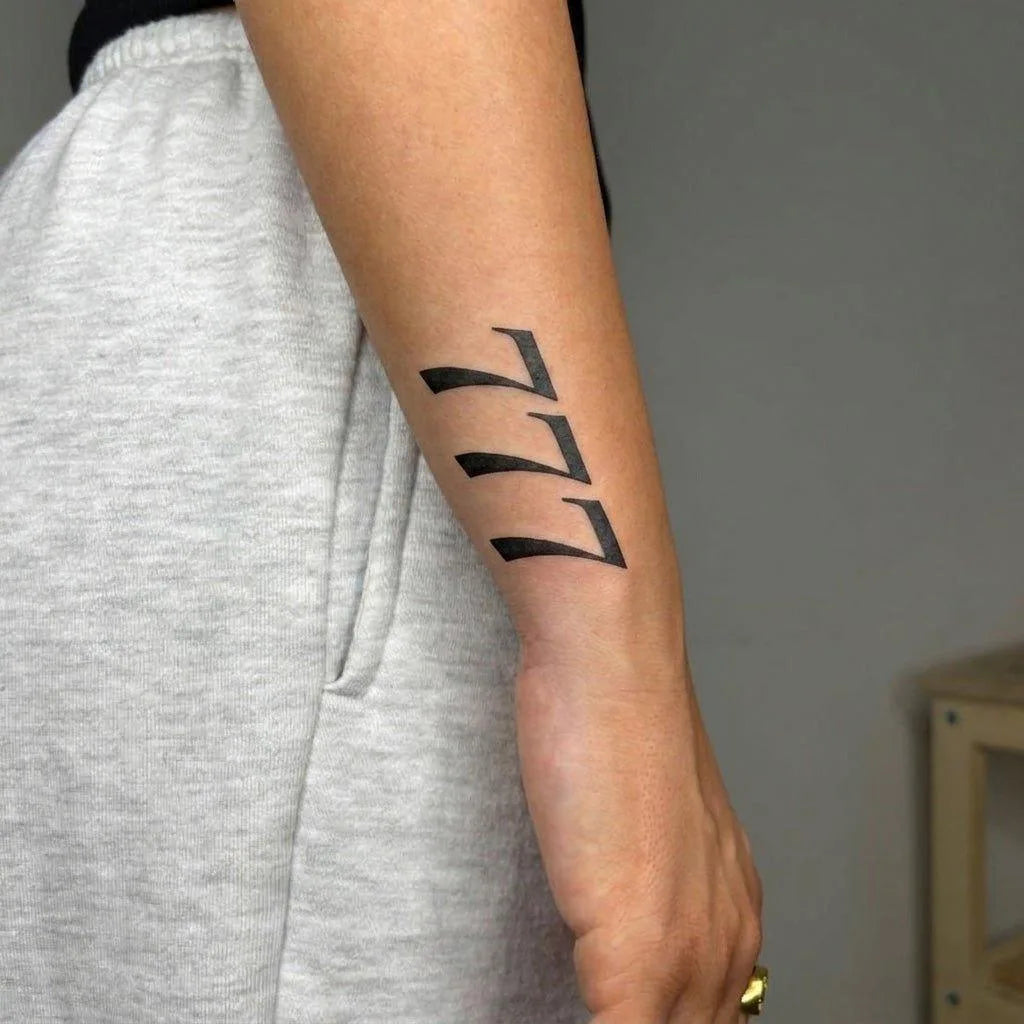 777 Angel Number Tattoo On Arm