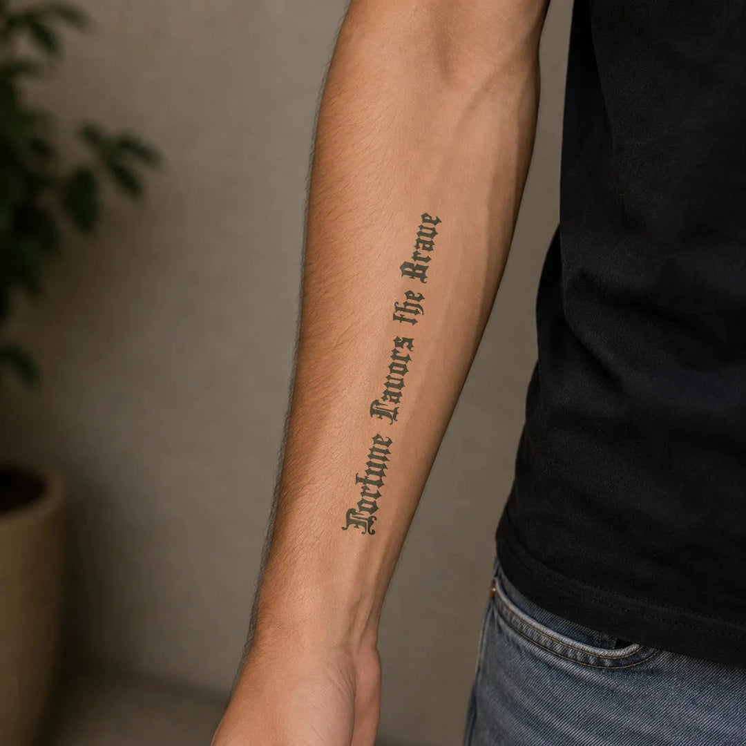 Fortune Favours The Brave tattoo on man arm