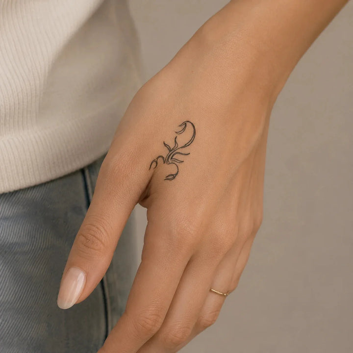 Scorpion Charm Tattoo on hand